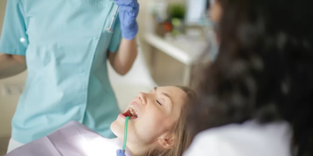 Young girl in the dental chair for wisdom teeth removal